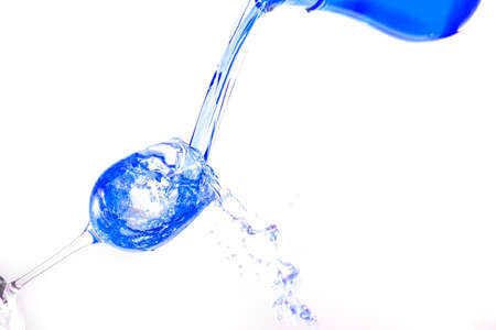 Fill glass with colorfull liquid.の写真素材