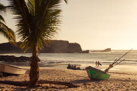 Small fishing boats and people on beachのeditorial素材
