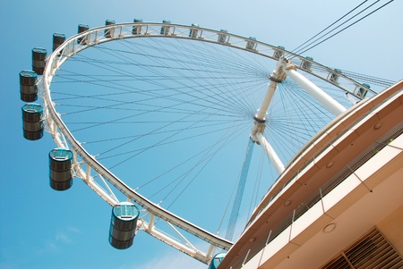 Singapore flyer against clear blue sky