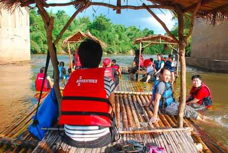 Bamboo raft with tourists on the Kwai river, Kanchanaburi, Thailandのeditorial素材