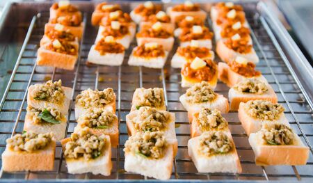 bread slices with pork ready for sale
