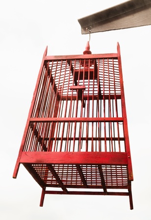 empty wooden bird cage isolated whiteの写真素材