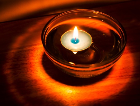 Aromatherapy candle floating in oilの写真素材