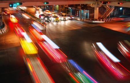 night speed traffic car light trail  at street junction of Bangkok Cityの写真素材