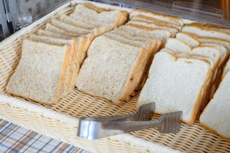slices of bread in basketの写真素材