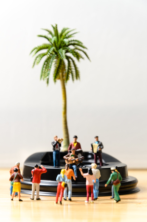 miniature musician vintage musical band on stage with audienceの写真素材