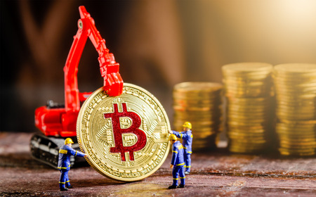 miniature figure technician engineer worker teamwork working on bitcoin. digital cryptocurrency conceptの写真素材