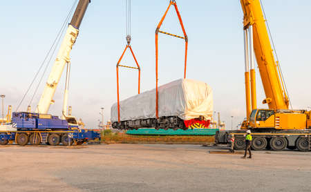 new electric diesel locomotive On the truck, waiting to be lifted onto the rails at the port  using ...