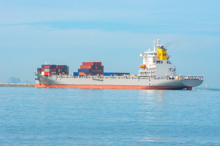 Top view of International Container ship loading, unloading at sea port, Freight Transportation, Shipping,  Vessel. Logistics, import export, Transportation. Global transport business.の写真素材