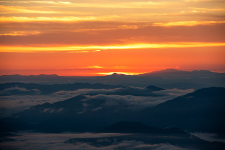 Aerial top view High mountain in morning time. Beautiful natural landscape Beautiful Sunrise Natural view on the hill, sea fogの写真素材