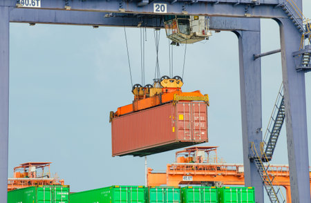 When the container terminal at dusk, work cranes and forklift.の写真素材