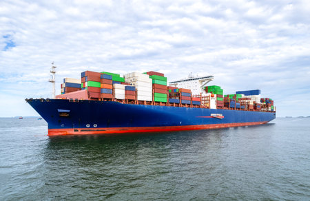 Logistics and transportation of Container Cargo ship  with working crane bridge in shipyard logistic...
