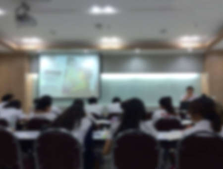 blur students  and teacher in the classroom for background usage.の写真素材