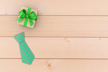 Fathers day composition of  tie laid and gift box on wooden floor backround 3d renderingの写真素材