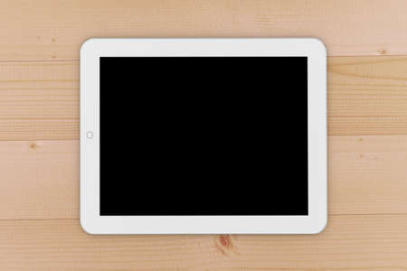 Balck digital tablet on wooden table top view ,3d renderingの写真素材
