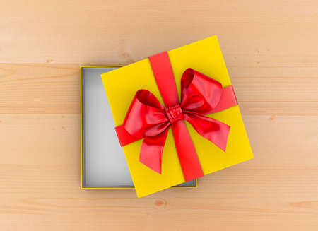 gift box Christmas, New Year's Day ,Open red yellow gift ribbon box top view on table wood background 3d renderingの写真素材