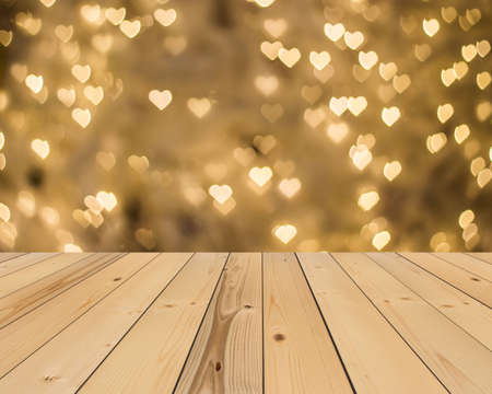 wood floor and yellow gold heart bokeh background , Love Valentine day conceptの写真素材