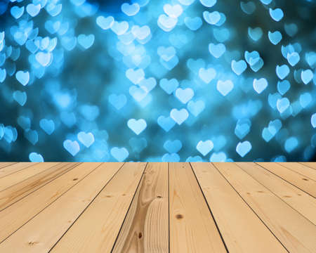 wood floor and blue heart bokeh background , Love Valentine day conceptの写真素材
