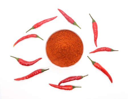 red chilies with chilly powder on white background