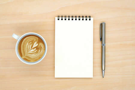 notebook on brown background top view copy spaceの写真素材