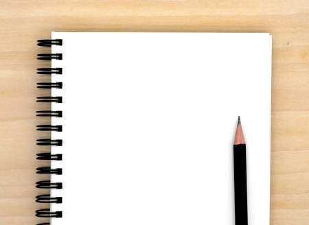 notebook on brown background top view copy spaceの写真素材