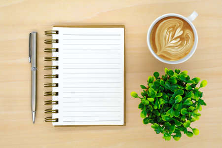 notebook on brown background top view copy spaceの写真素材