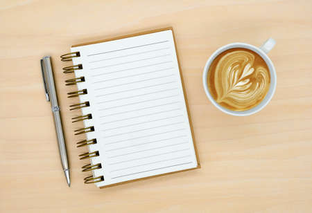 notebook on brown background top view copy spaceの写真素材