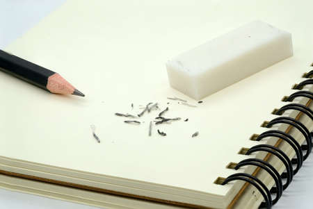 eraser removing a written mistake on a piece of paper.の写真素材