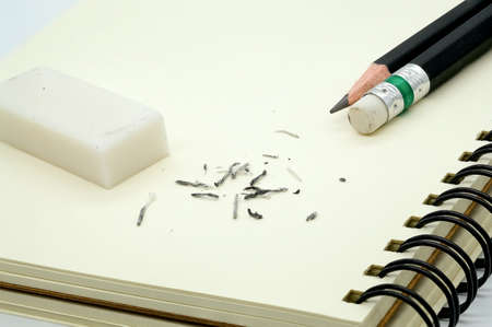 eraser removing a written mistake on a piece of paper.の写真素材