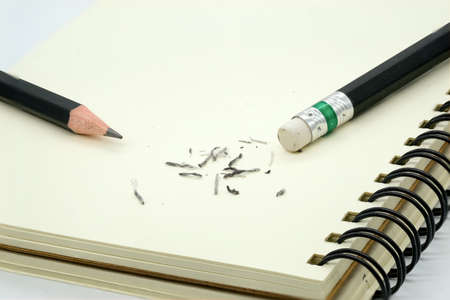 eraser removing a written mistake on a piece of paper.の写真素材