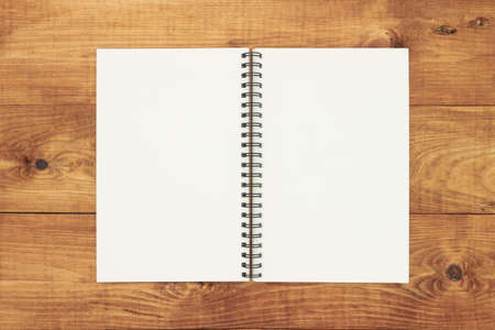 notebook on brown background top view copy spaceの写真素材