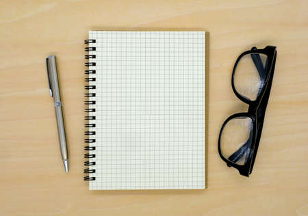 notebook on brown background top view copy spaceの写真素材