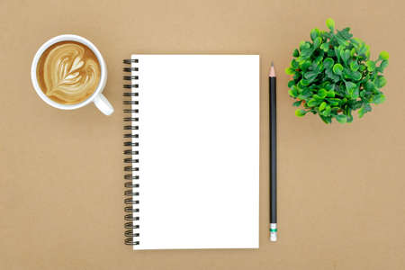 notebook on brown background top view copy spaceの写真素材