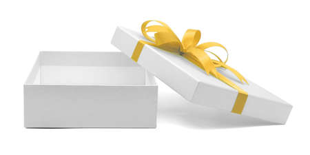Christmas and New Year's Day , Open yellow gift box white background with clipping pathの写真素材