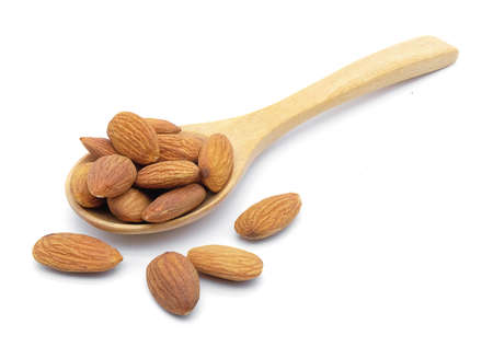 almonds  in spoon on white background isolateの写真素材