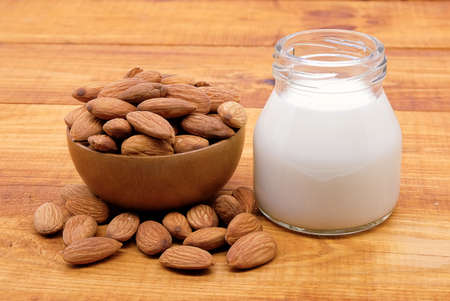 almonds milk on wood backgroundの写真素材