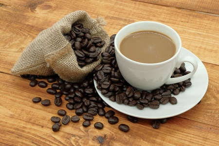 coffee beans on wood background top viewの写真素材