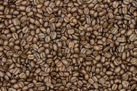coffee beans on wood background top view and copy spaceの写真素材