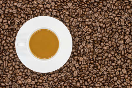 coffee beans on wood background top view and copy spaceの写真素材