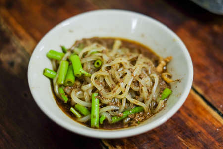 Bowl of noodle soup with morning glory (Moo nam tok) , Thailand.の写真素材