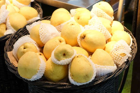 Many Asian Pears in basket at market for fruit background or texture.の写真素材