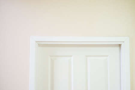White wooden door in the white room.の写真素材