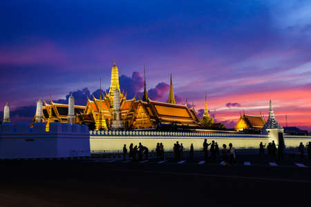 Beautiful Grand palace & Wat phra keaw (Wat Phra Sri Rattana Satsadaram) at twilight sunset with people - Bangkok, Thailand (Famous buddhist temple for tourist).のeditorial素材