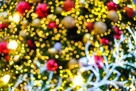 Colorful blurred (bokeh) christmas tree with reindeer for background or texture - Merry Christmas and Happy new year 2018 concept.の写真素材
