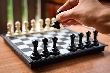 Hand holding chess (Pawn) for leader background or texture - Business & Strategy Concept.の写真素材