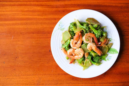 The hot stir fried broccoli with giant shrimp serve on dish - food concept.の写真素材