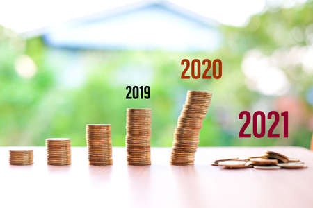 2019 to 2021, Money reduced (not saving) for your current situation (Coronavirus or COVID-19) isolated on nature background - bad economy & economical concept.の写真素材