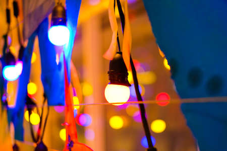 The colorful (red, green and yellow) incandescent light bulbs (shine) for background or texture concept.の写真素材