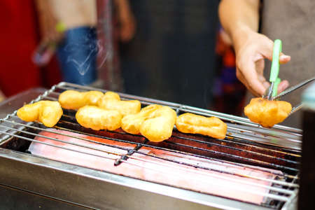 Homemade grill chinese bread stick (chinese donut or beh teung guai) at Yaowarat Thailand - food concept.の写真素材