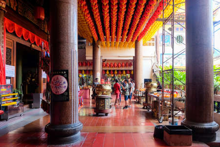 Penang, Malaysia - December 20, 2019 : The interior Kek Lok Si temple (a buddhist famous temple situated in Penang) with people come to ask for blessings.のeditorial素材